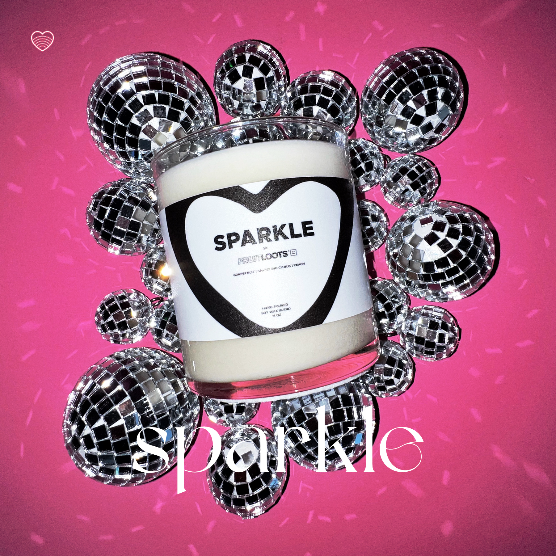 "SPARKLE" candle by Fruitloots! This gorgeous candle sits in a bed of tiny disco balls as it sparkles all around the image.