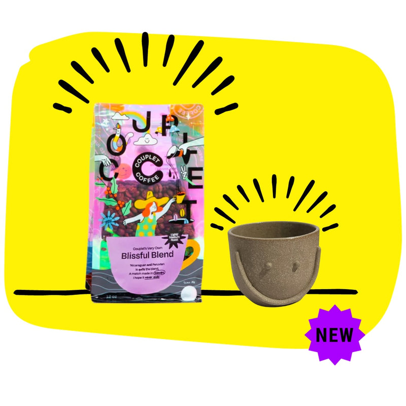 Couplet Coffee Bag in bright iridescent colors stands next to the hand made "Smile Mug" in cream by Jumie Ceramics 