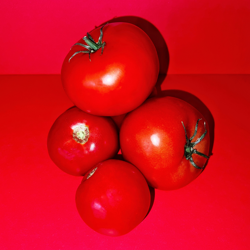 4 bright red tomatoes - a reflection of the scent