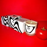 Home Candle features a clear vase with black and white modern heart design. Box replicates the heart pattern on the front. All black and white modern design.