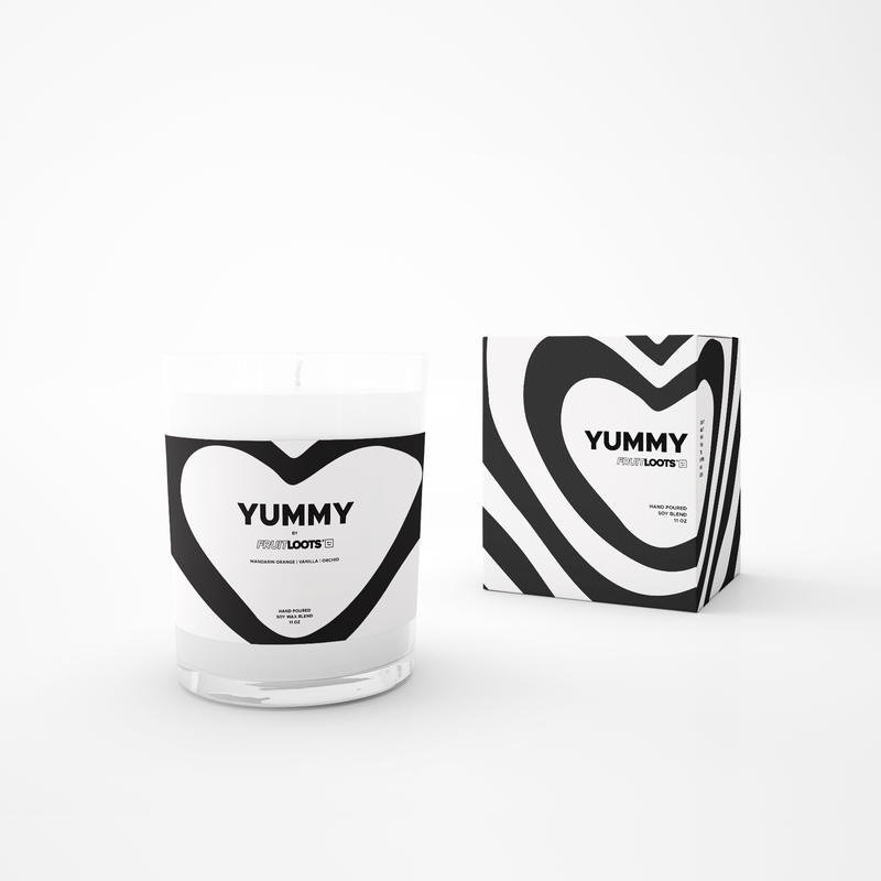 Yummy Candle features a clear vase with black and white modern heart design. Box replicates the heart pattern on the front. All black and white modern design. 11 oz, hand poured in West Hollywood, CA. Soy/Wax Blend. 