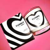 YUMMY Candle features a clear vase with black and white modern heart design. Box replicates the heart pattern on the front. All black and white modern design.